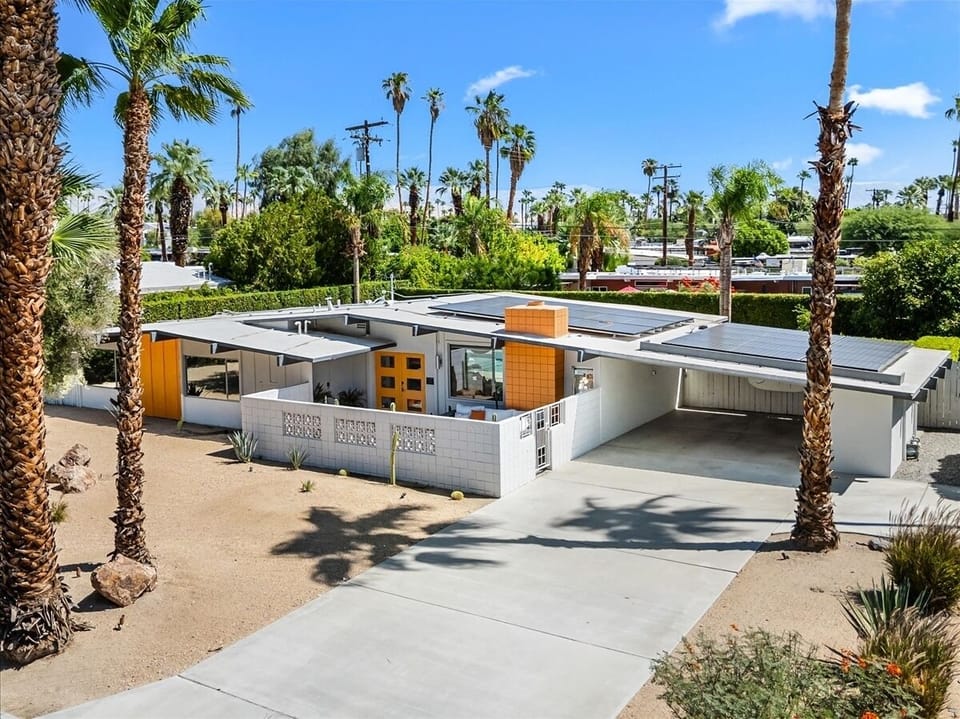 Palm Springs mid-century gem w/ iconic roofline, bold door & private poo