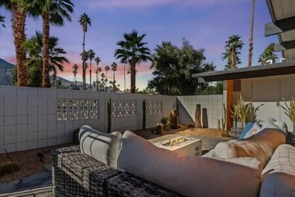 Private mid-century Palm Springs patio with fire pit perfection.