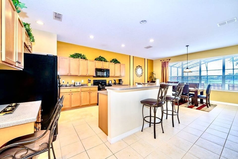 Beautiful open plan kitchen with views of the pool area