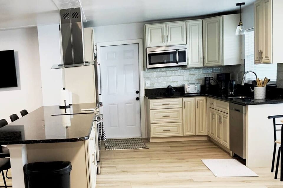 KITCHEN
-Flattop ELECTRIC Stove with CONVECTION Oven
FRIDGE to back-ICE MAKER/Double Door
Microwave
Undercount sink
Dishwasher
12' Island with 5 stools
Kitchen Table has 2 additional chairs - upon request, and can expand 2x
50" Smart TV