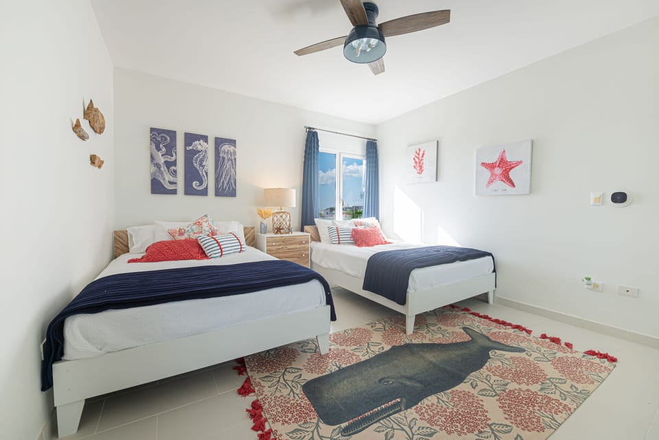 Garden Bedroom with built in closet, zoned AC and ceiling fan.