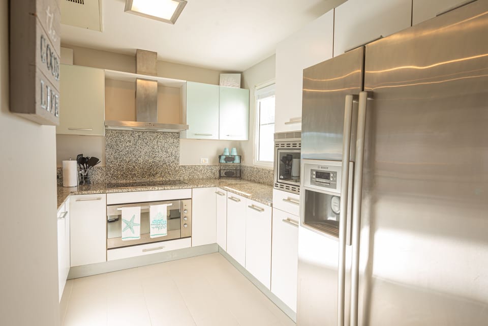  dishwasher, micro, induction cooktop, ice maker, oven, water treatment
