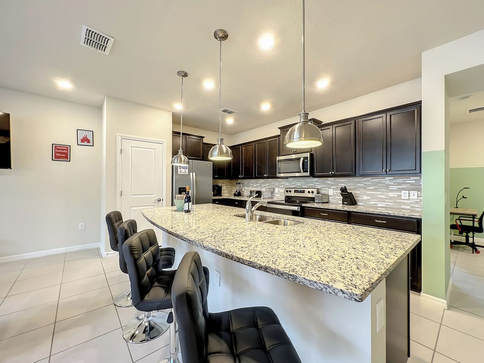 Whip up meals or snacks in a gourmet kitchen with ample bar seating.