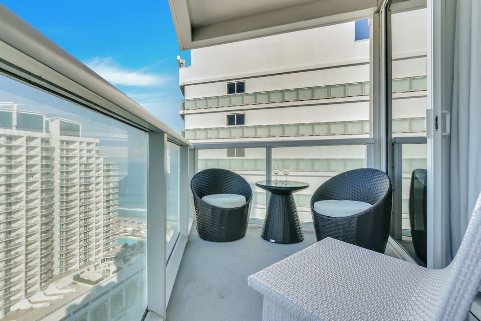 Private Balcony | Ocean view with a conversation seating area.