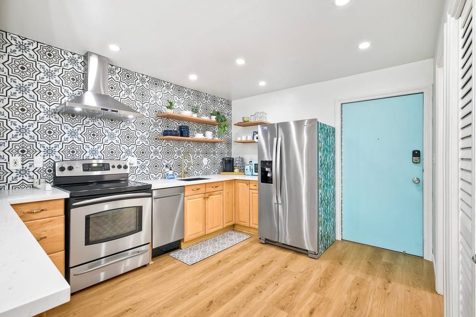 Kitchen and the front door of the condo
