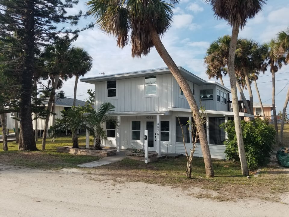 Front of house, and parking area.