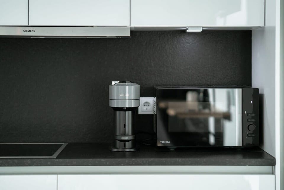 Compact and modern kitchen amenities provide all you need for a hassle-free stay.