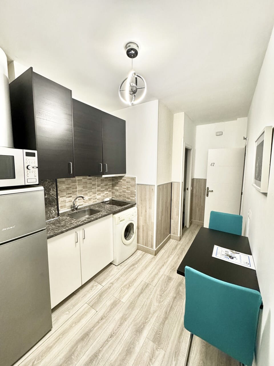 The living room has fully equipped kitchenette with a dining table and enough space to make your stay as pleasant as possible.