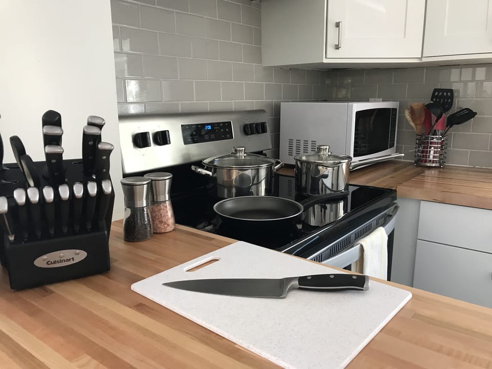 Full kitchen - pots, pans, dishes, utensils, etc.