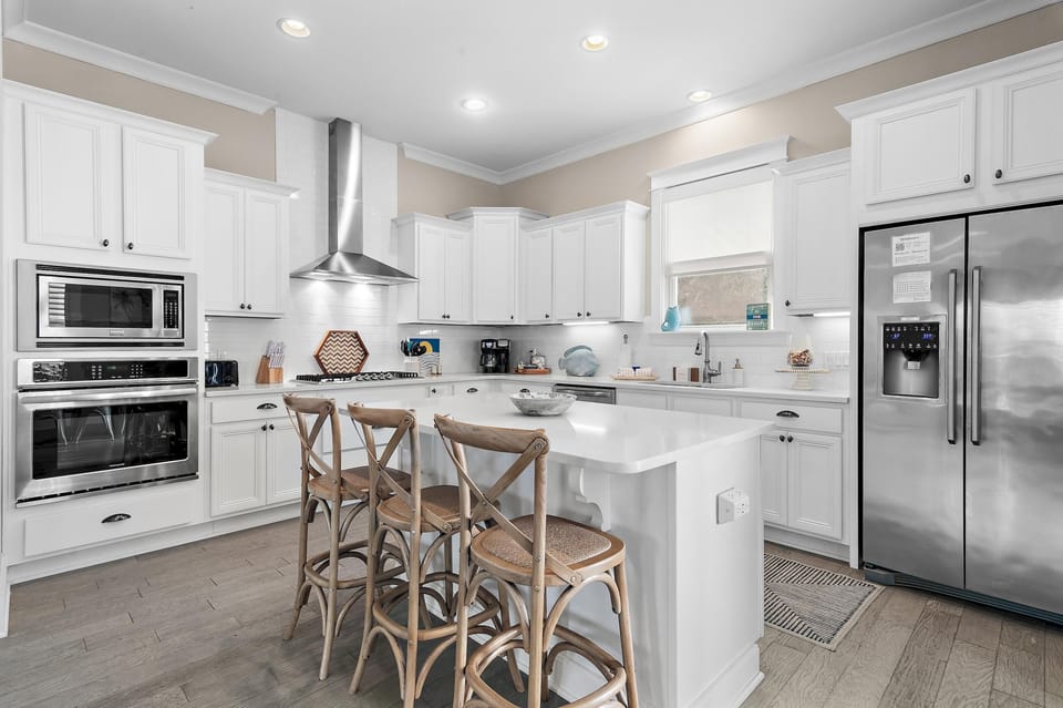 Bright, modern kitchen with spacious island and cozy seating