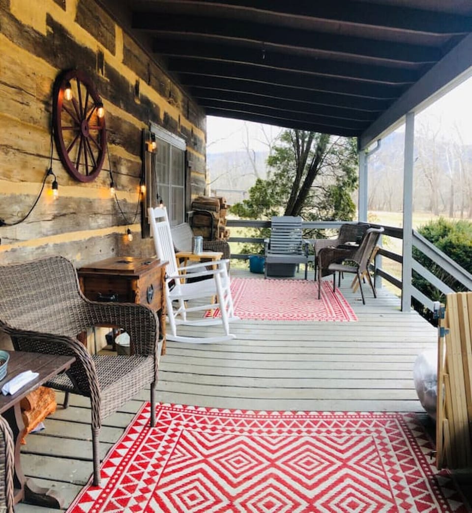 Large country porch with river and winter mountain view