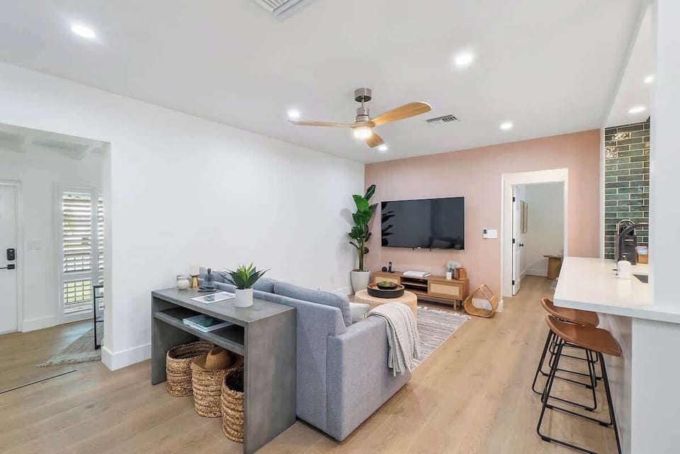 Unit 1 (2 bed/2bath) professionally designed spacious living room with 65" Roku smart TV.  Open floor plan.