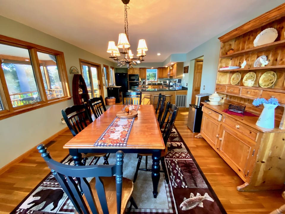 Large dining table with a fantastic view of the lake.