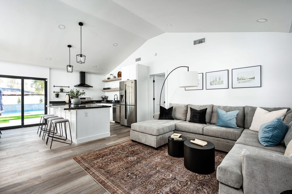The living room, kitchen, and dining are all centralized for maximum gathering space.