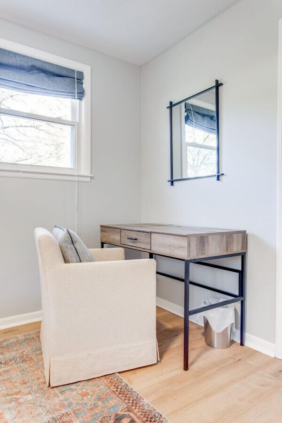Queen guest room with a desk.