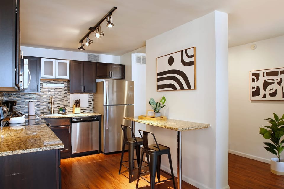 Spacious kitchen with granite countertops and stainless appliances