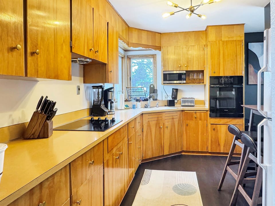 Quaint kitchen - fully stocked with cookware, dishes, and all the essentials.