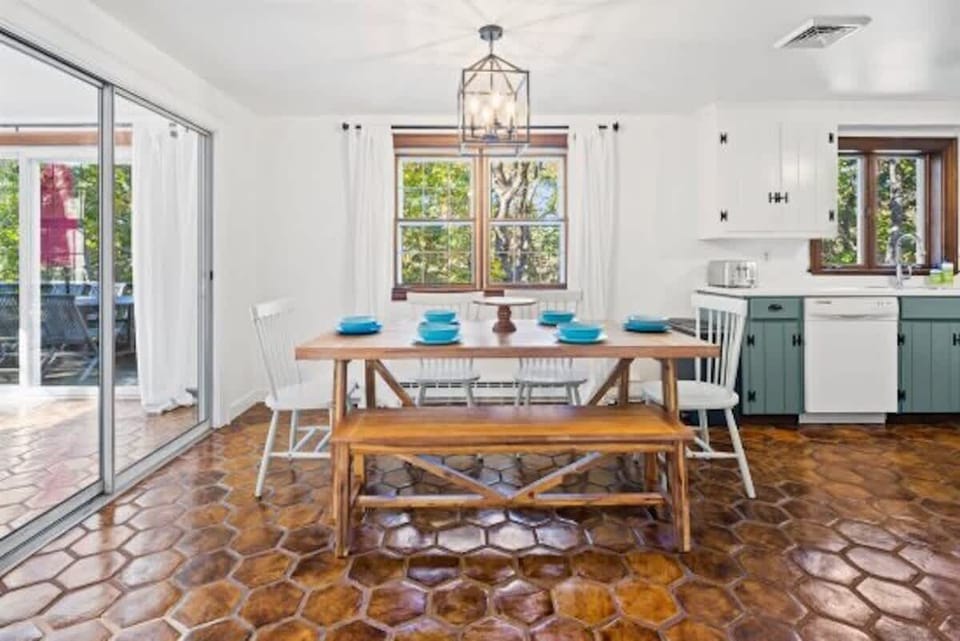 Living room leads into opening dining room and kitchen