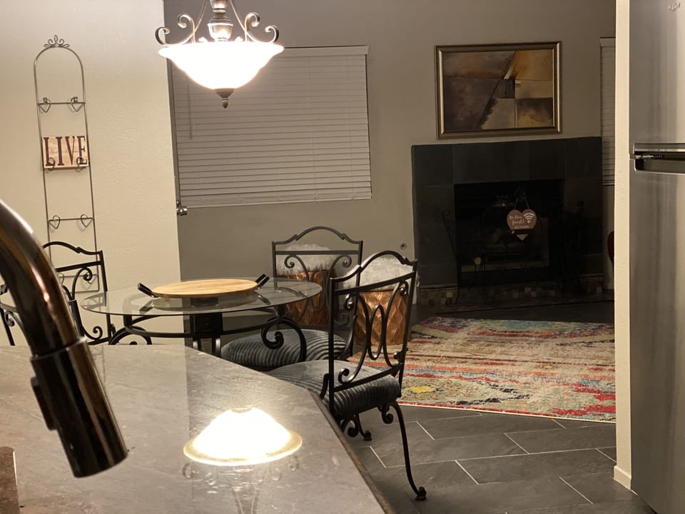 Kitchen has granite countertops, stainless steel appliances and maple cabinets.