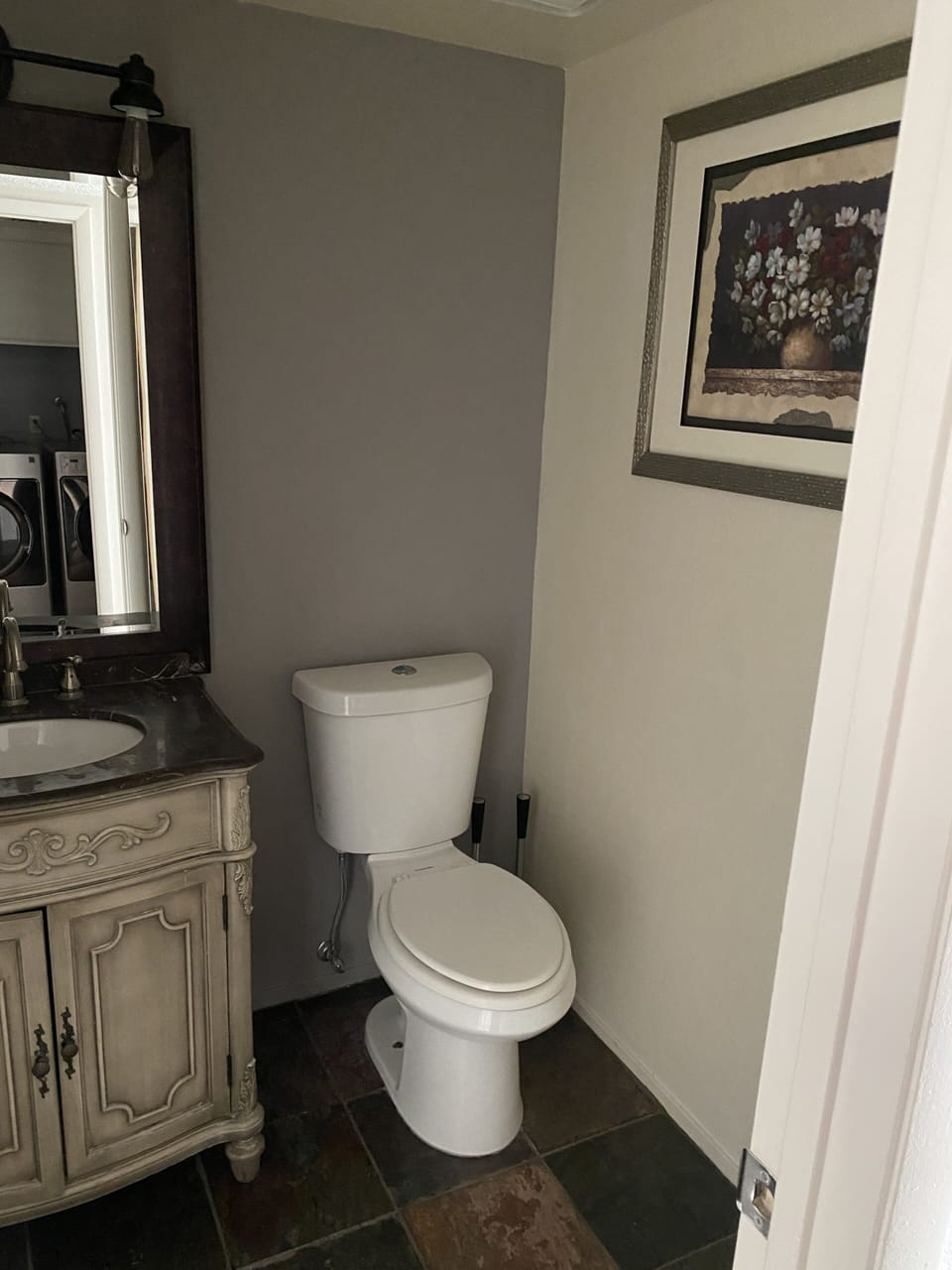 Half bath on main floor off den/tv area; two full baths upstairs.