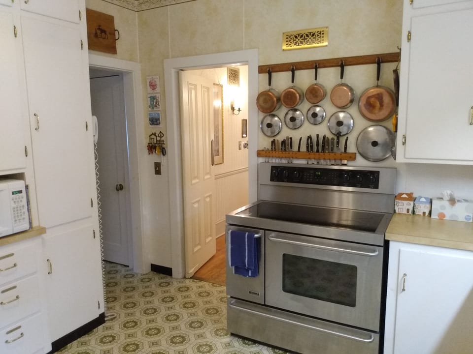 View from kitchen into dining room on right