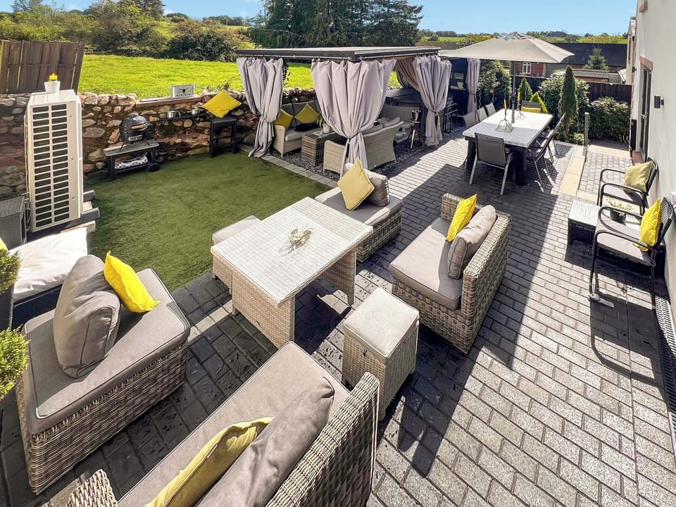 our gorgeous secure garden area outdoor living dining and hot tub area | Cherry Cottage, Little Salkeld, near Penrith