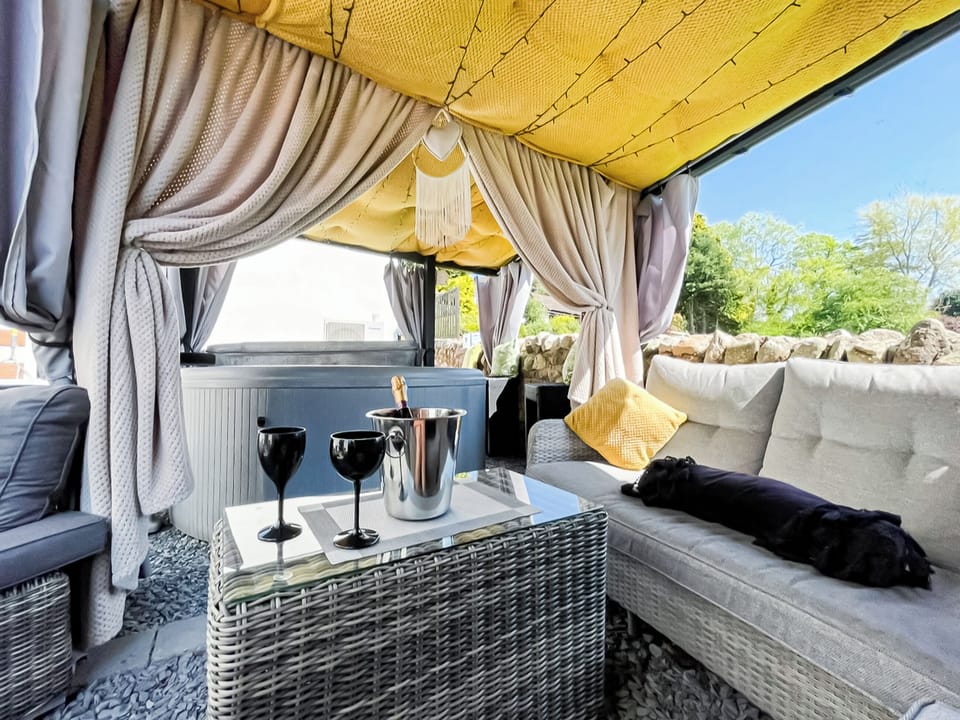 Outdoor living area with hot tub | Cherry Cottage, Little Salkeld, near Penrith