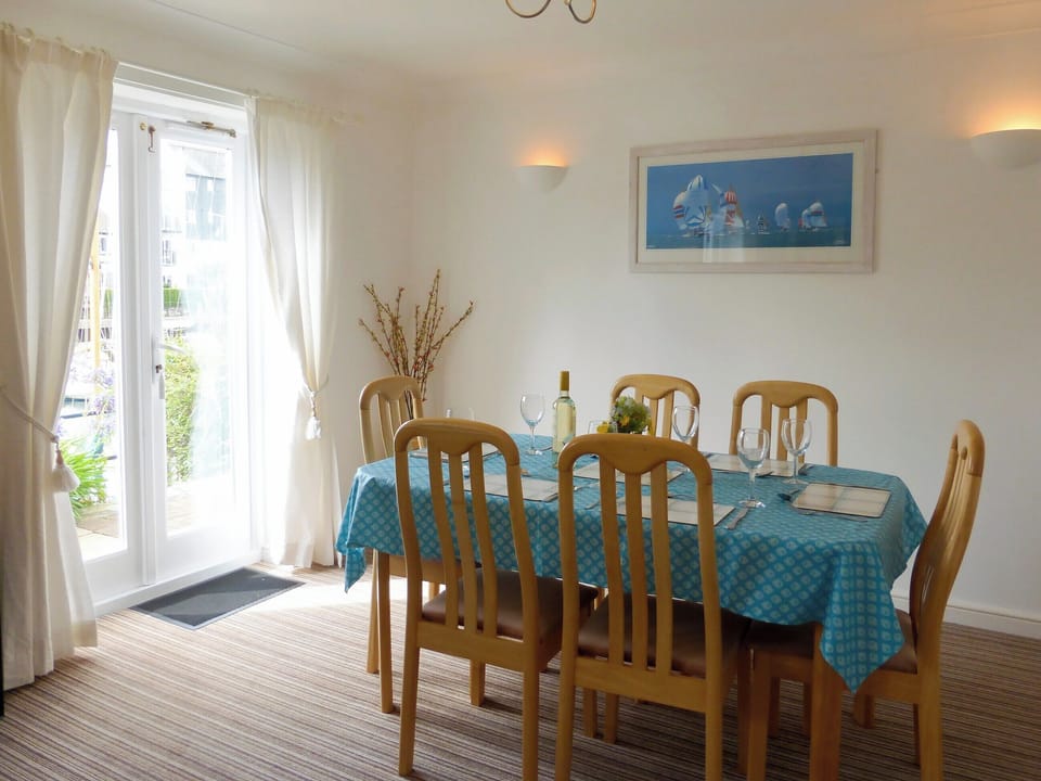 Living/dining room with patio doors | Spinnakers, Falmouth