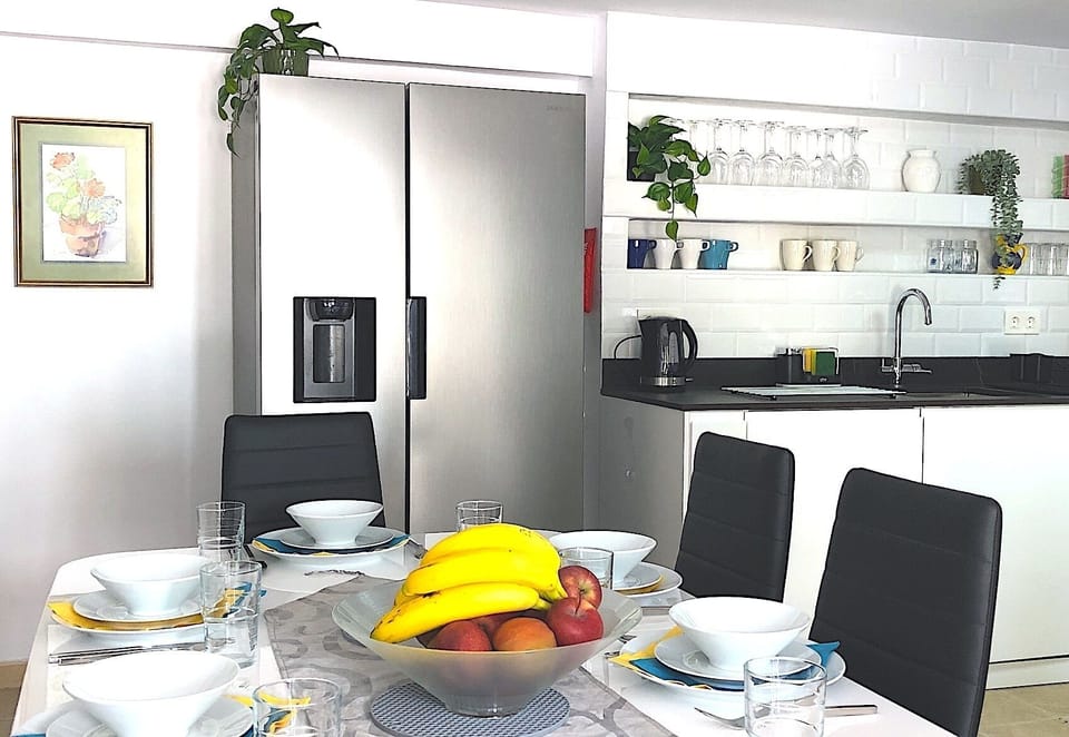 American fridge/freezer with filtered chilled water, crushed ice and ice cubes. 