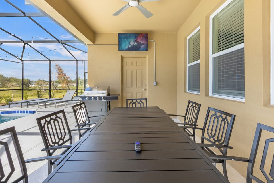 The pool  has a large dining area, BBQ grill,  smarTV, and 4 lounging chairs!