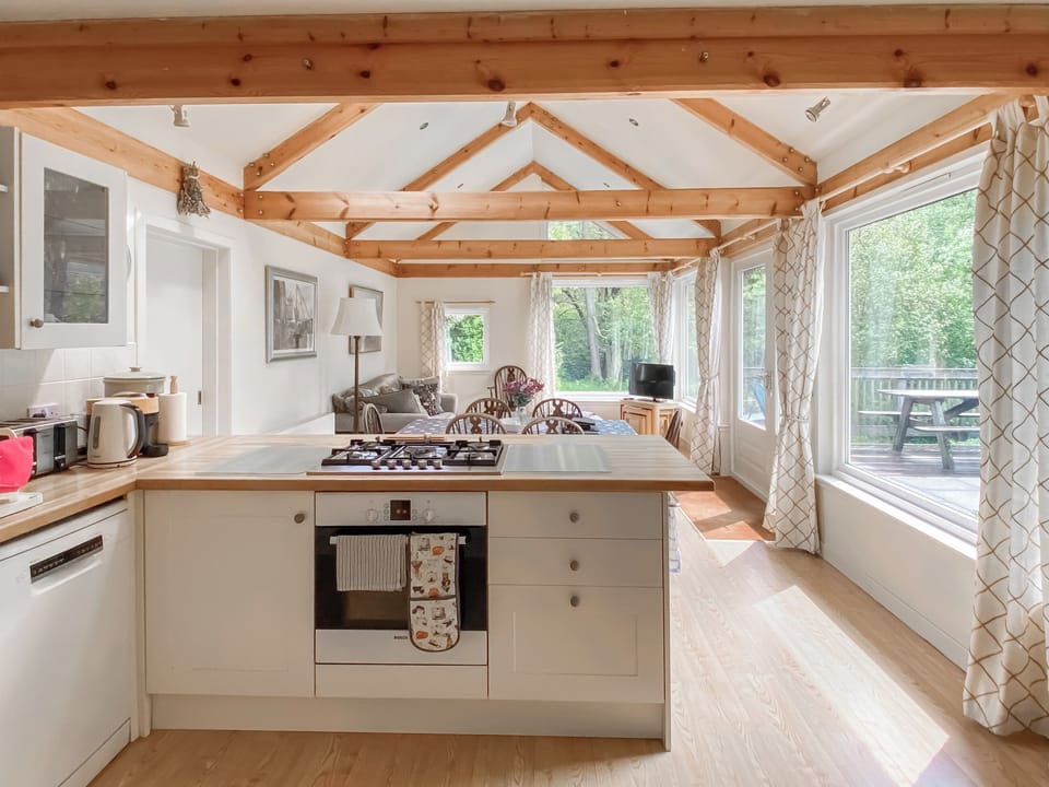 Looking through kitchen to dining and living areas beyond | Garrique Cottage, By Kippen, near Stirling