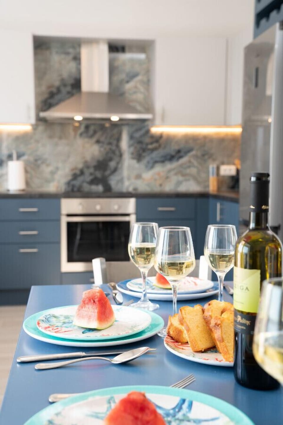An open floor plan provides large kitchen and dining for six on the ground floor