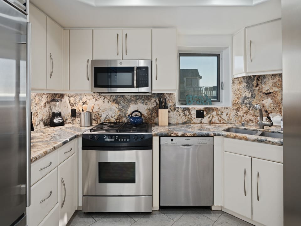 Enjoy sleek modern cabinetry, marble countertops, and top-of-the-line appliances.