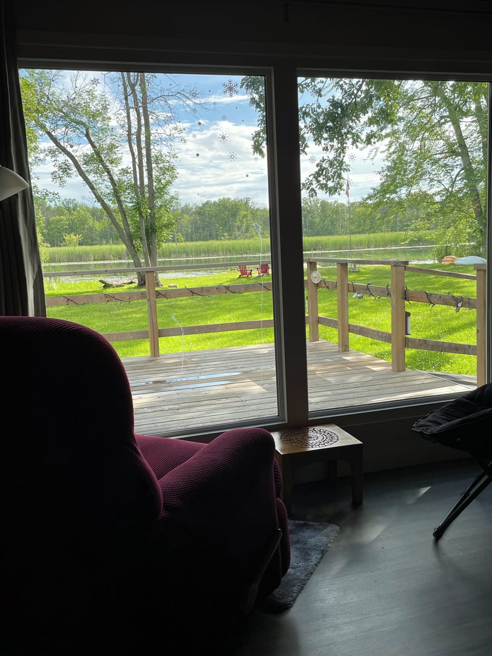 The 2 river-view chairs by the large living room window 