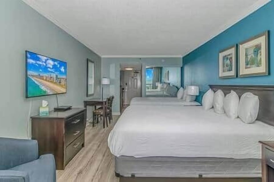 Cozy and inviting space with smart TV, dining/work desk, and plenty of room to relax.