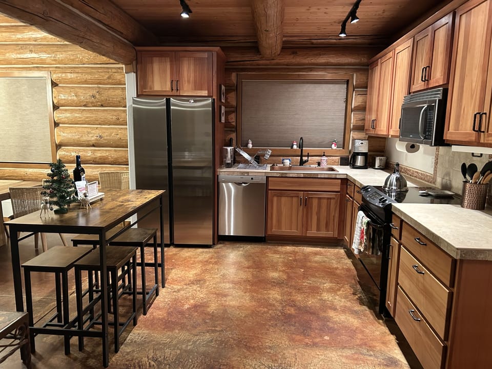 Fully stocked kitchen and extra seating in the island.  New fridge 2024.