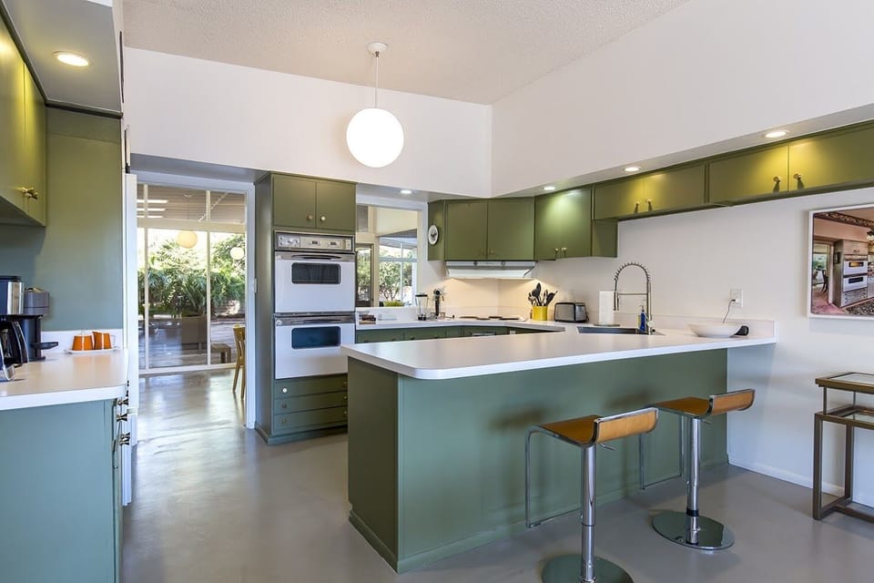 Kitchen with eat-in counter and stools 