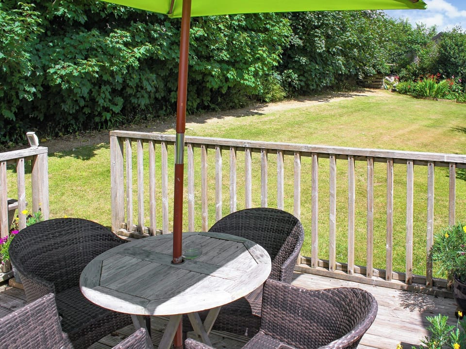 Private deck off lounge area with hot tub access and BBQ | Little Fursdon Apartment, Liskeard