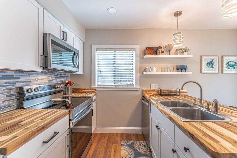 Well-equipped kitchen with modern appliances including a Keurig.
