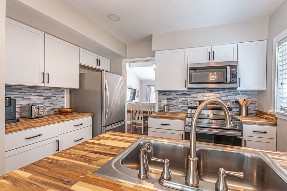 Beautifully furnished and well-equipped kitchen with modern appliances including a Keurig.