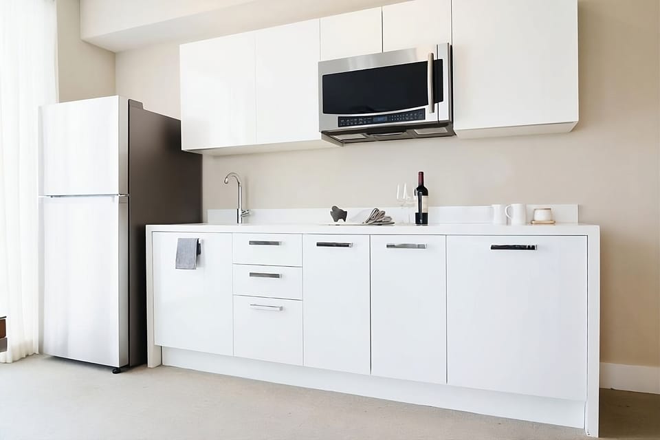 Whip up simple meals with a bright, modern kitchenette setup.
