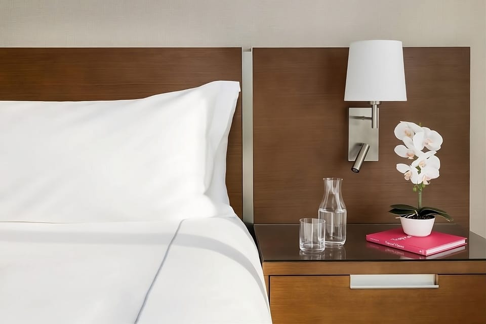 Admire thoughtful bedside touches for a pampered stay.