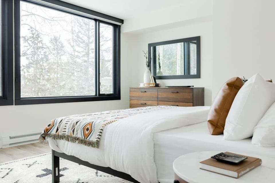 The bedroom has a king bed