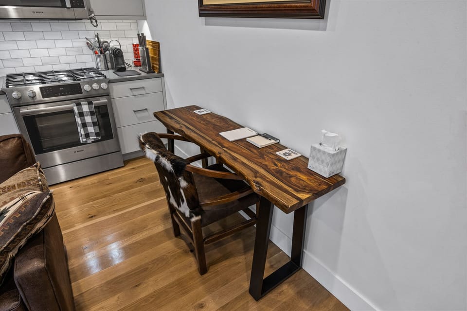 Small desk in living room  area to get any work done.