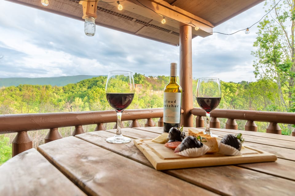 Cozy sitting area with table on the balcony deck upstairs over looking mountains