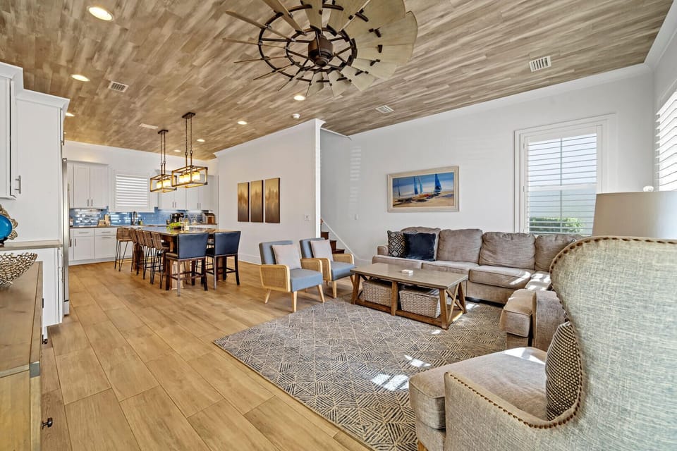 Welcome into a spacious and welcoming main floor living and open concept kitchen that the entire group can enjoy