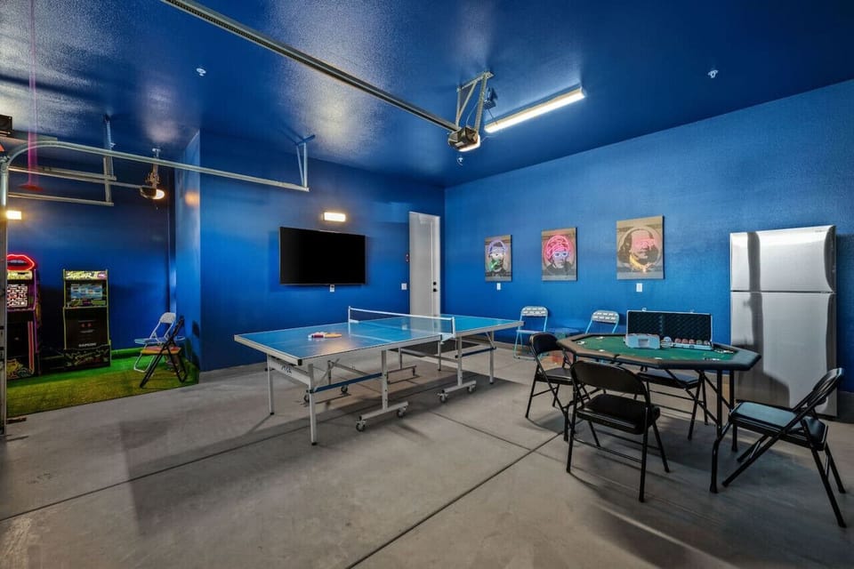 Retro-inspired game room w/ arcade machines, ping pong & lounge space for group fun.