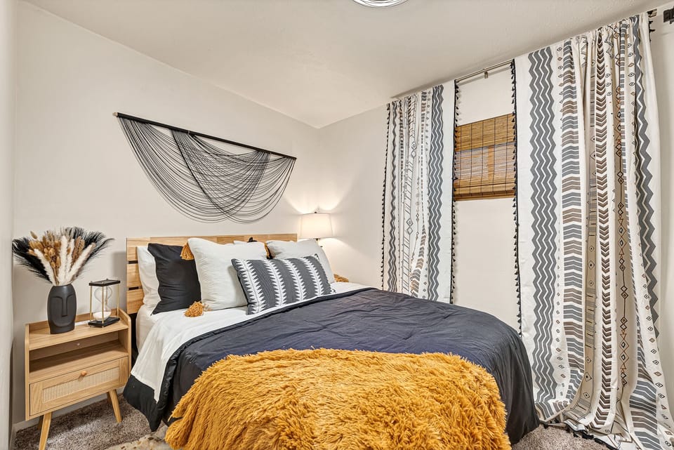 the "Boho Den". First bedroom to your left, entering thru the upstairs