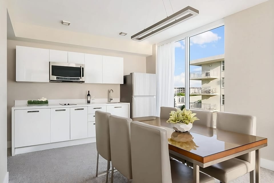 Cook simple favorites in a sleek kitchen with sunny windows.