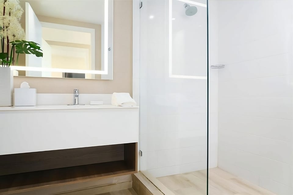 Refresh under a sleek glass shower with spa-like serenity.
